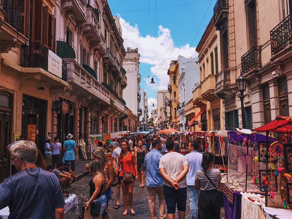 People walking in the San Telmo street market in Buenos Aires.