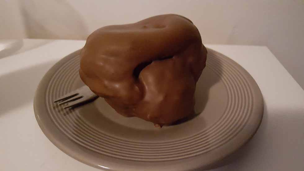 Pastry ball covered with chocolate in Den Bosch. Dutch Bossche Bol.