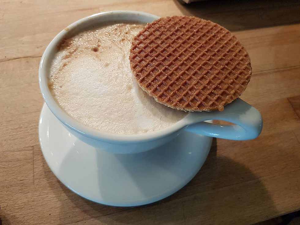 Stroopwaffel on a mug with coffee in Amsterdam
