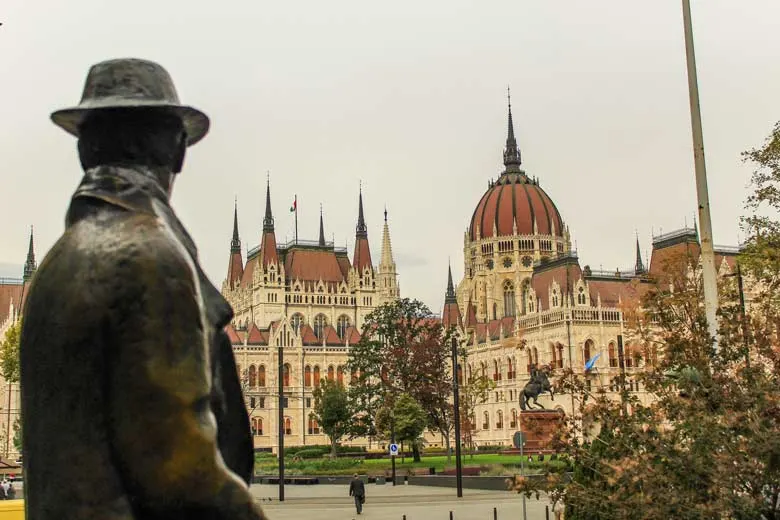 Imre Nagy statue looking at the Hungarian Parliament in Budapest