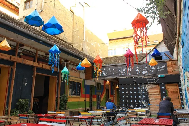 Colorful lamps and empty tables at Kuplung ruin pub in Budapest