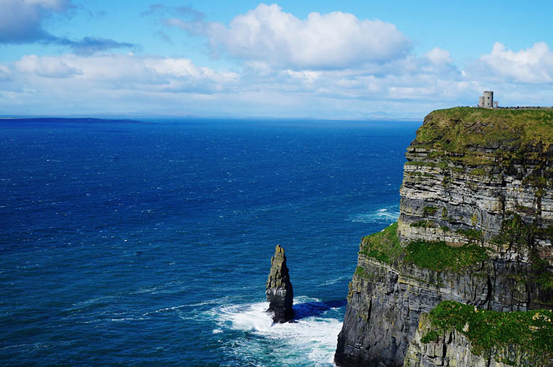 Sea stack and O'Brien Tower at the Cliffs of Moher at the Irish coast.