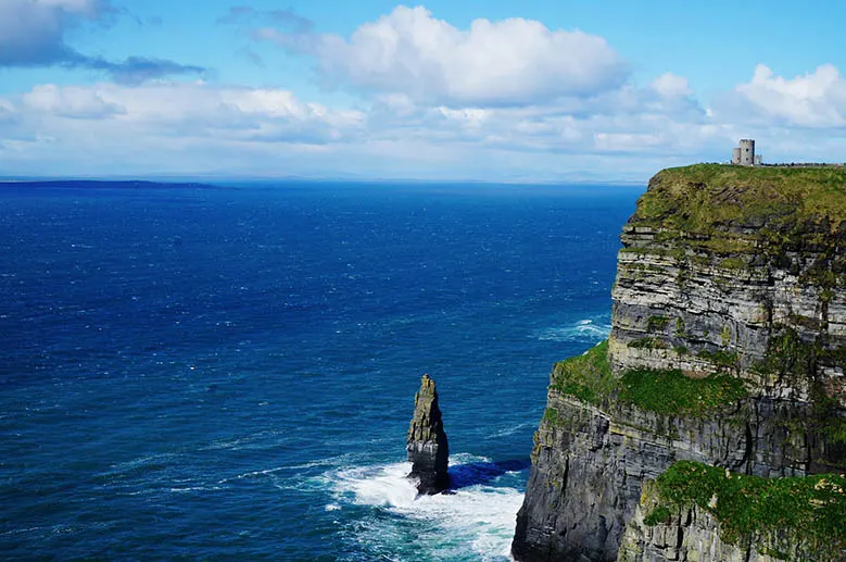 Sea stack and O'Brien Tower at the Cliffs of Moher at the Irish coast. #Ireland #CliffsofMoher #Europe #Travel