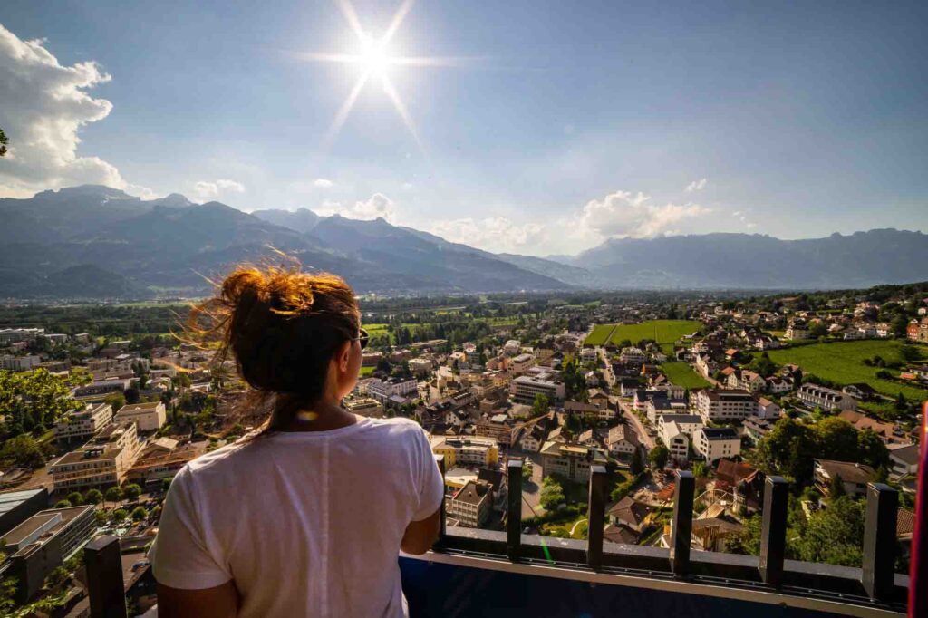 Female tourist admiring view of Vaduz, Liechtenstein