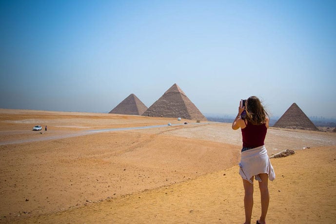 Girl and the pyramids of Egypt