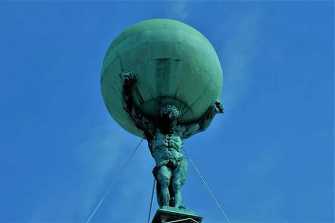 The Atlas statue at the Royal Palace is one of the best photo spots in Amsterdam