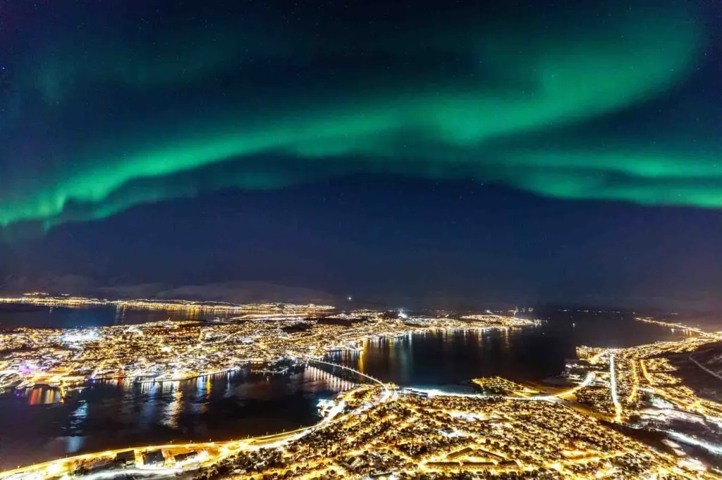 Incredible Northern lights activity above Tromso in Northern Norway