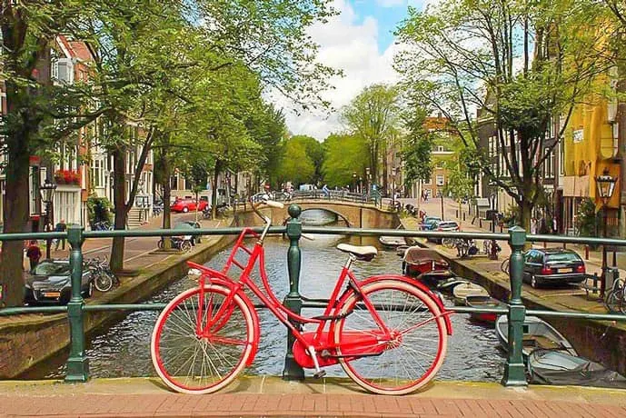 Red bike on a canal in an Amsterdam picture
