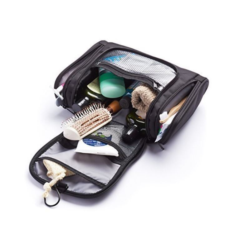 Open black toiletry bag with cosmetics.