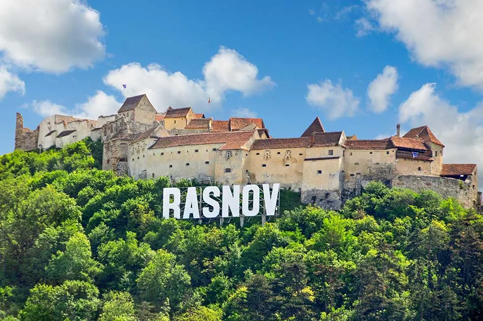 Rasnov board sign in front of the Rasnov citadel