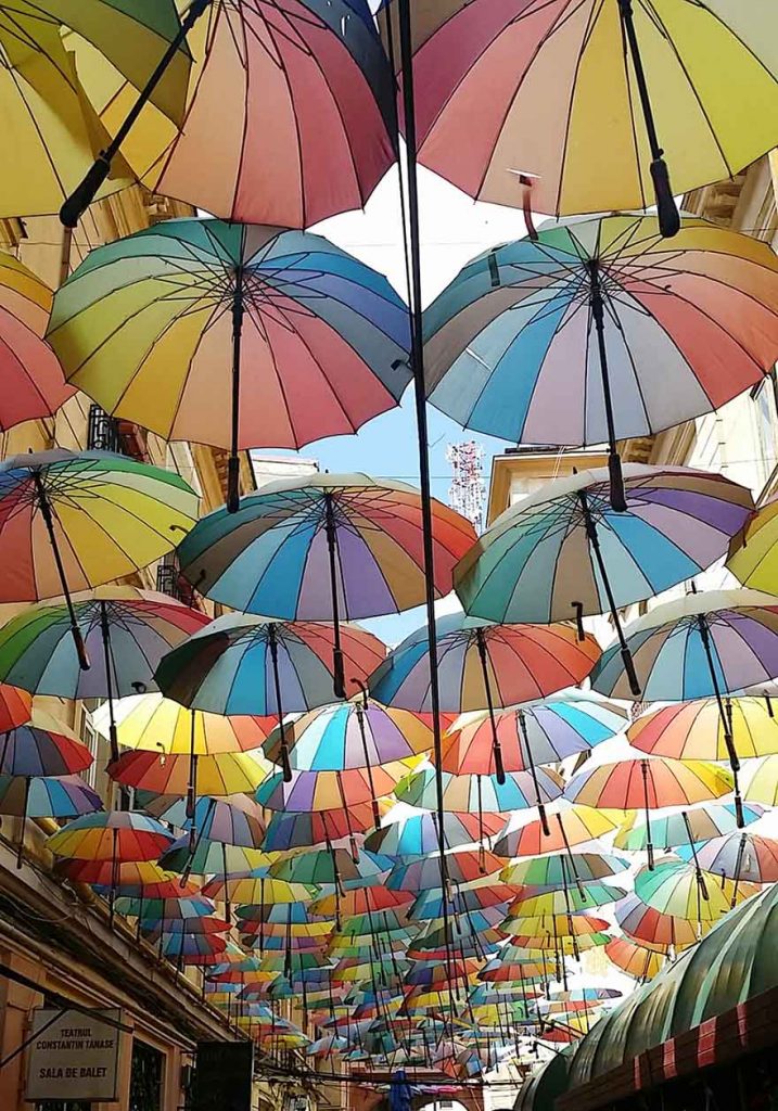 Colorful umbrellas covering the Victoria Passage in Bucharest, Romania.