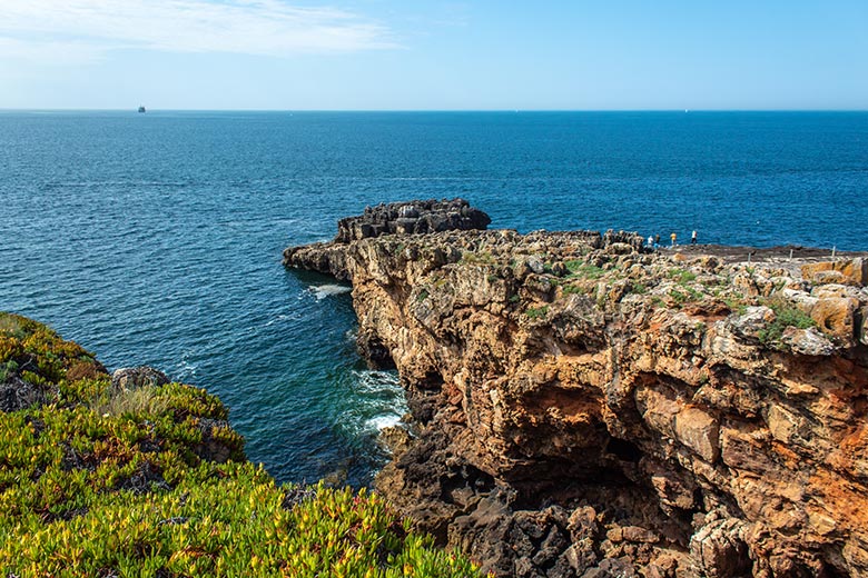 Rock formation and blue ocean in Cascais