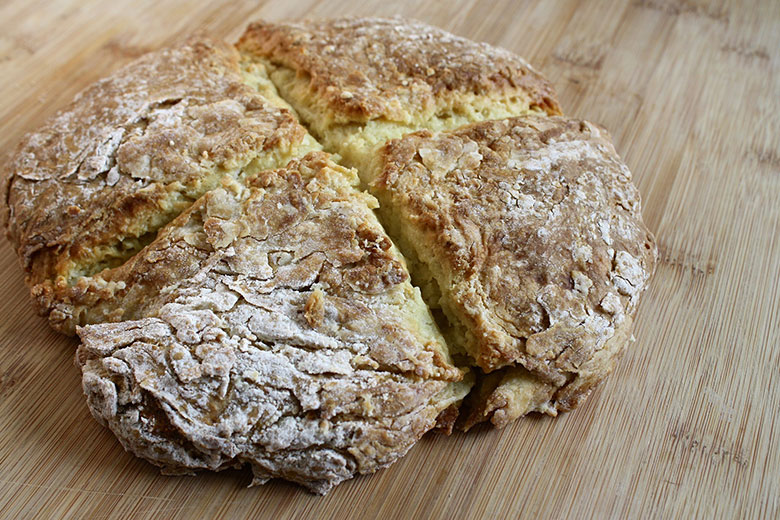 Irish soda bread on a light wooden table