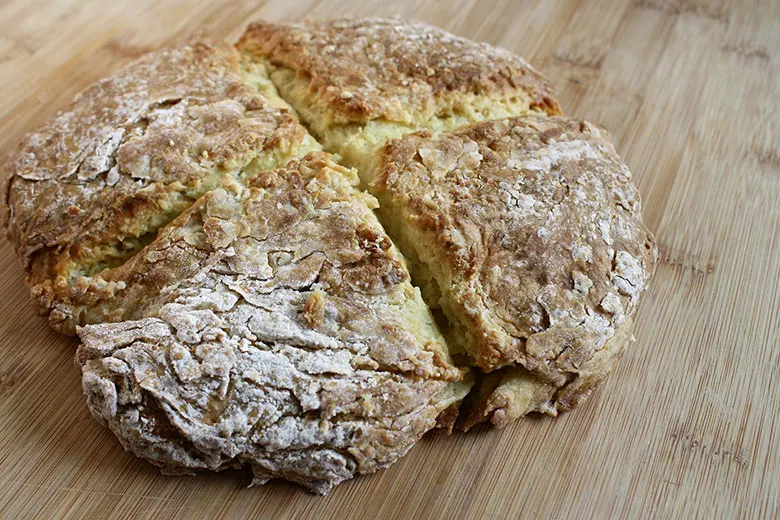 Irish soda bread on a light wooden table