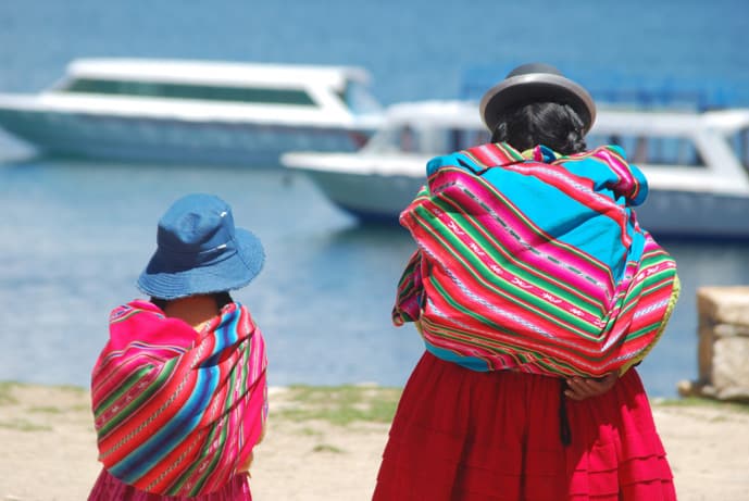 Bolivian woman and child wearing pink clothes