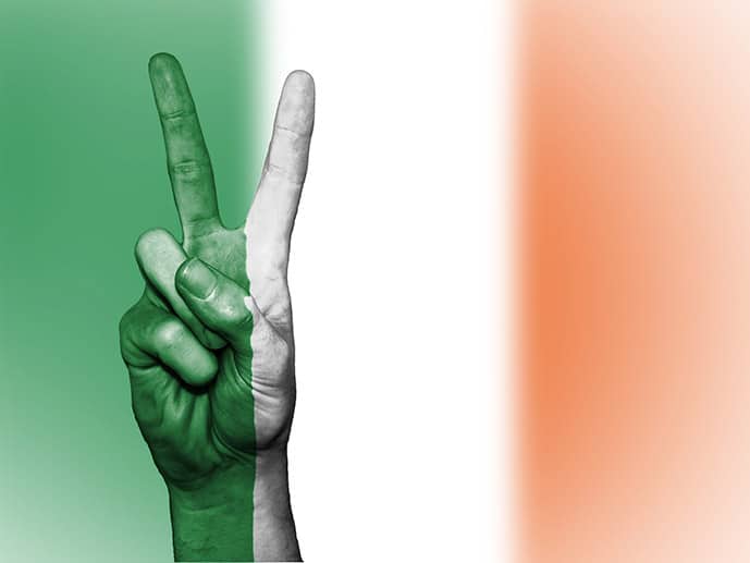 Flag of Ireland and hand with peace sign