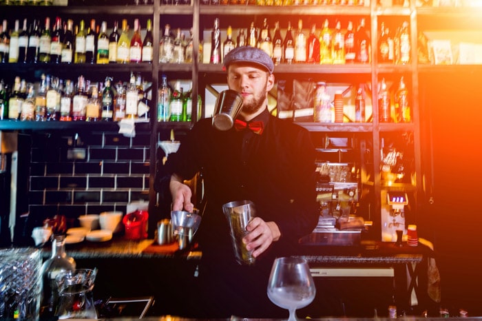 Bartender in vintage bar in London