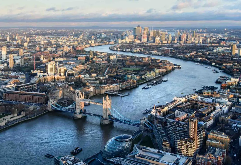 Arial view of London with the River Thames and Tower Bridge at sunset
