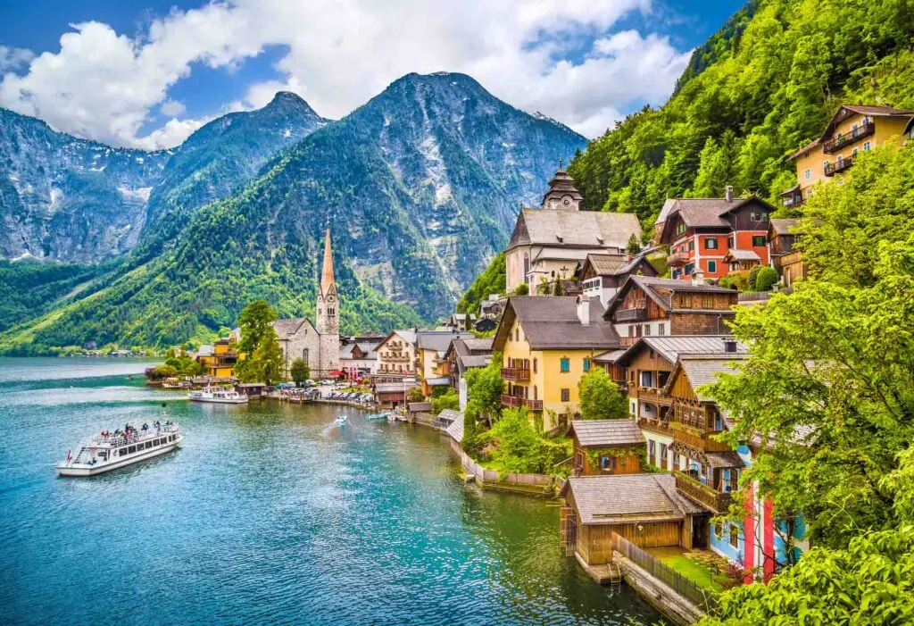 Scenic picture-postcard view of famous Hallstatt mountain village with Hallstaetter Lake in the Austrian Alps, region of Salzkammergut, Austria